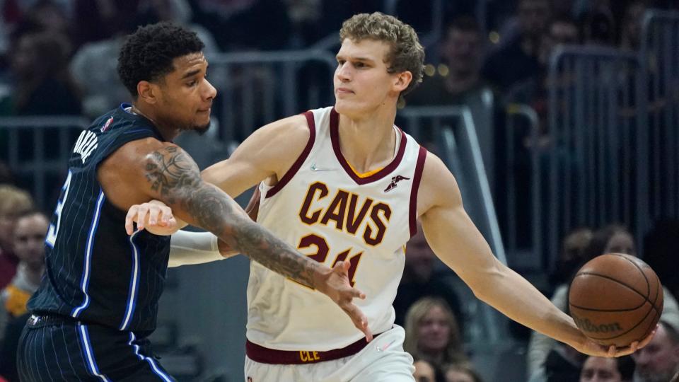 Cavaliers forward Lauri Markkanen (24) looks to pass against the Orlando Magic's Chuma Okeke (3) during the Cavs' 105-92 win Saturday night in Cleveland. Markkanen scored 20 points for the Cavs. [Tony Dejak/Associated Press]