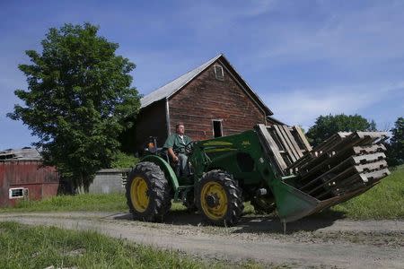 James Murphy, an inmate at the State of New York Wallkill Correctional Facility, drives a tractor on a prison farm in Wallkill, New York June 16, 2014. REUTERS/Shannon Stapleton