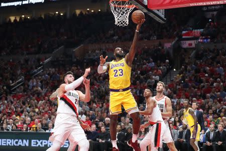 Oct 18, 2018; Portland, OR, USA; Los Angeles Lakers forward LeBron James (23) shoots over Portland Trail Blazers center Jusuf Nurkic (27) in the first half at Moda Center. Mandatory Credit: Jaime Valdez-USA TODAY Sports