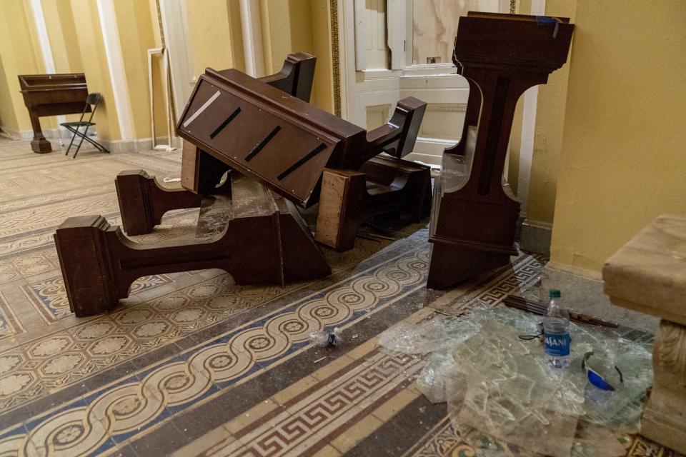 Damage is visible in the hallways of the Capitol early Thursday after protesters stormed the building a day earlier. (Photo: ASSOCIATED PRESS)