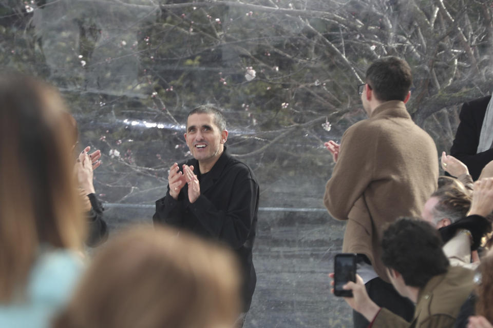 Designer Felipe Oliveira Baptista, centre, accepts applause at the conclusion of the Kenzo fashion collection during Women's fashion week Fall/Winter 2020/21 presented in Paris, Wednesday, Feb. 26, 2020. (AP Photo/Thibault Camus)