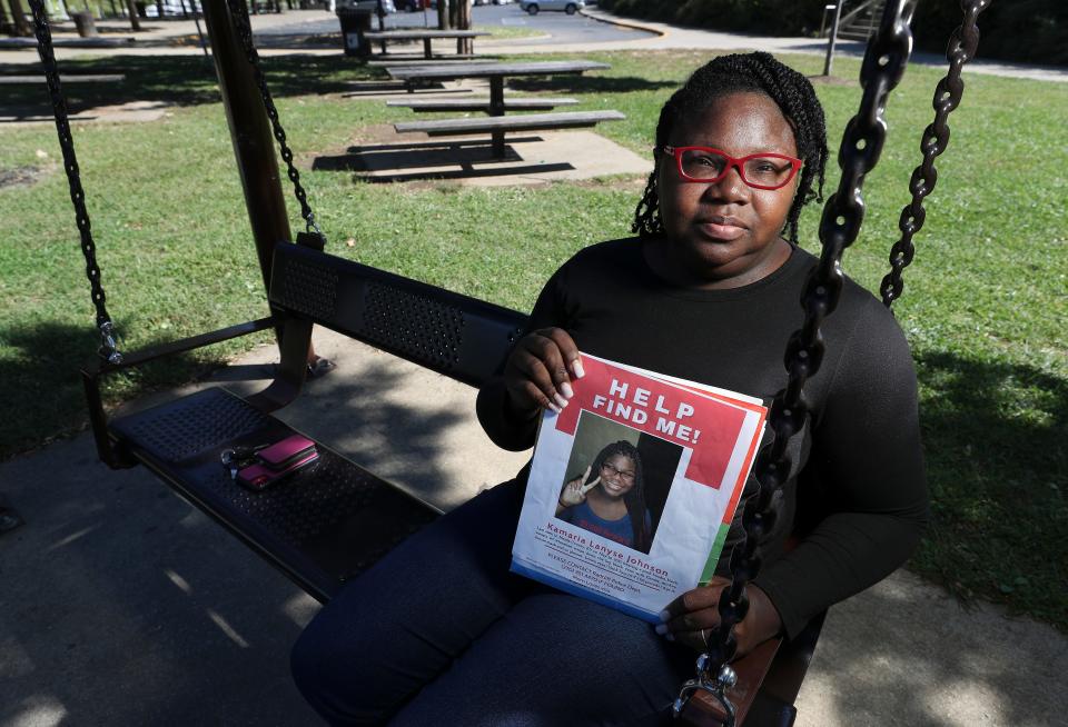 Consuela Jobe sits n a swing at the Big Four Lawn in Louisville, Kentucky, on Sept. 27. Jobe said she would often bring her children to play at the park. Her daughter, Kamaria Johnson, was 16 when she went missing in 2021 and Jobe believes that a delay in media attention prevented her from being located quickly.