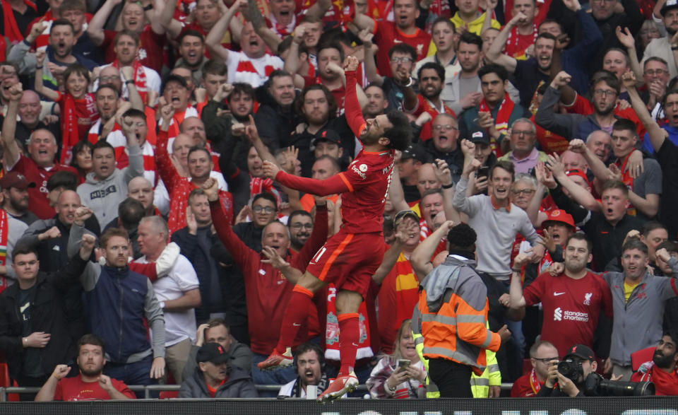 Liverpool's Mohamed Salah celebrates after scoring his goal during the Premier League soccer match between Liverpool and Wolverhampton at Anfield stadium in Liverpool, England, Sunday, May 22, 2022. (AP Photo/Jon Super)