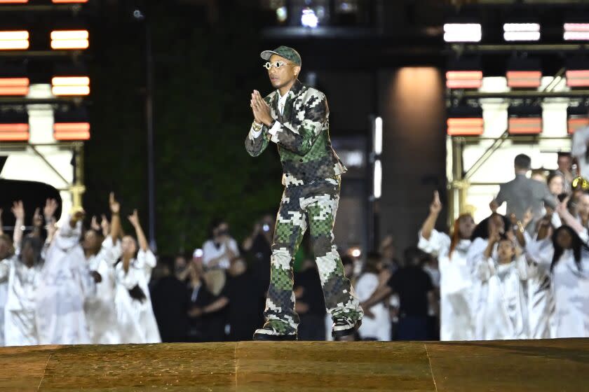 PARIS, FRANCE - JUNE 20: (EDITORIAL USE ONLY - For Non-Editorial use please seek approval from Fashion House) Louis Vuitton Men's Creative Director Pharrell Williams acknowledges the applause of the audience after the Louis Vuitton Menswear Spring/Summer 2024 show as part of Paris Fashion Week on June 20, 2023 in Paris, France. (Photo by Aurelien Meunier/Getty Images)