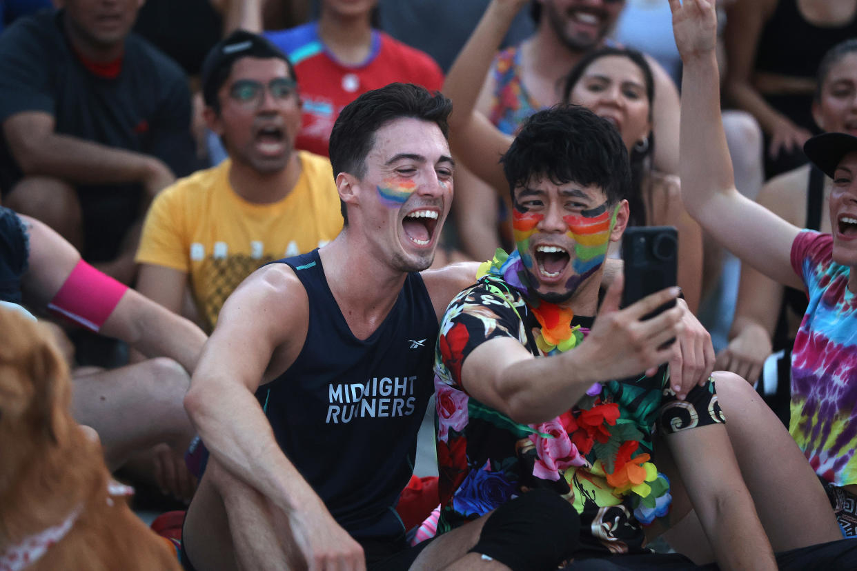 The Midnight Runners, a running club and fitness community gather at Toronto's Nathan Phillips Square for a Pride-themed run on June 21, 2022. (Steve Russell/Toronto Star via Getty Images)