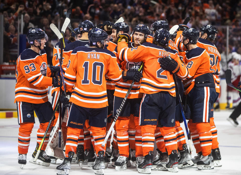 Edmonton Oilers celebrate an overtime win over the New York Rangers in an NHL hockey game Friday, Nov. 5, 2021, in Edmonton, Alberta. (Jason Franson/The Canadian Press via AP)