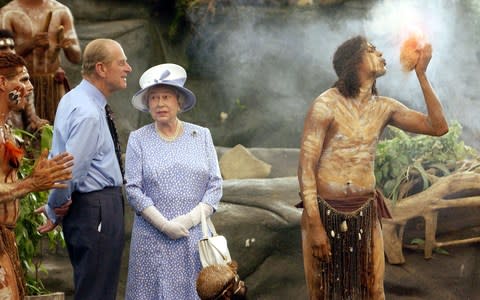 The Queen and the Duke of Edinburgh watch a culture show at Tjapukai Aboriginal Culture Park, Cairns - Credit: PA