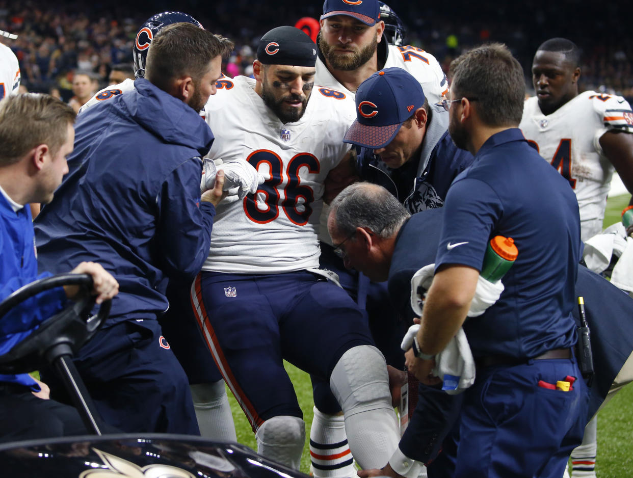 Chicago Bears tight end Zach Miller is placed on a cart after injuring his leg in the second half of Sunday’s game against the New Orleans Saints. (AP)