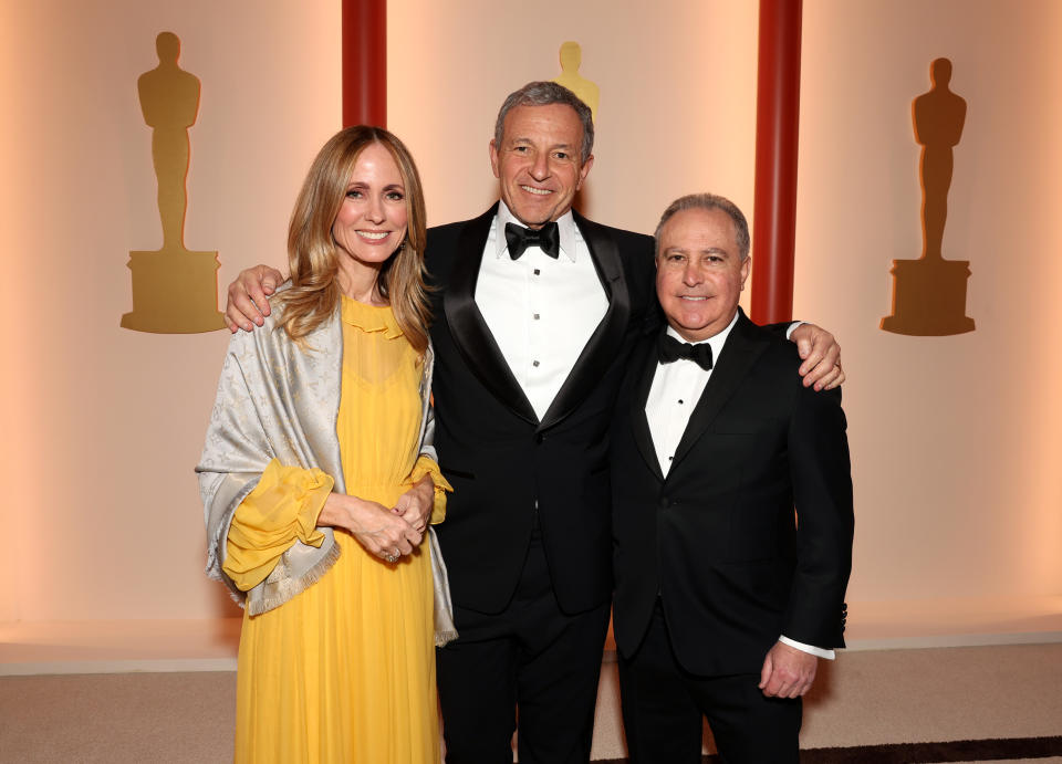 Dana Walden, Bob Iger, and Alan Bergman attend the 2023 Oscars - Credit: Getty Images