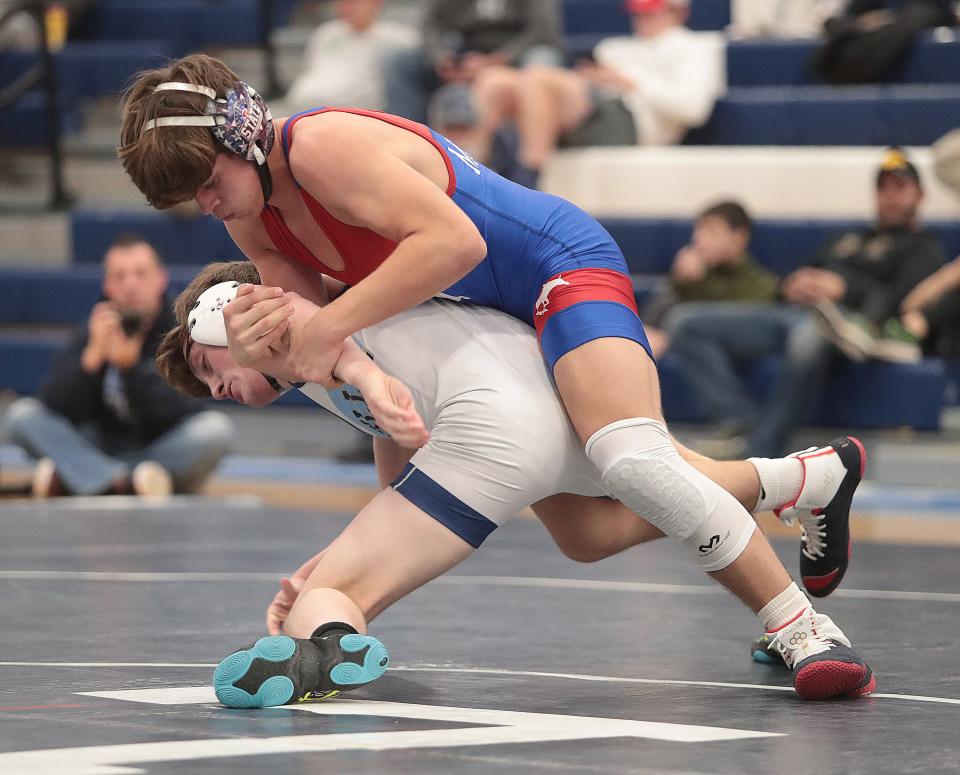 Tuslaw's Jacob Lyons has control over Louisville's Josiah Walker in their 150-pound matchup.