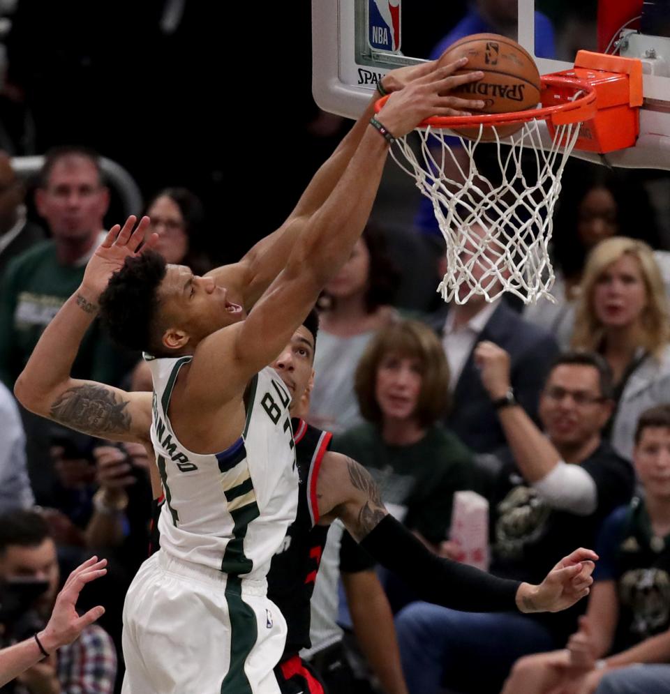 Bucks forward Giannis Antetokounmpo rises for a dunk.