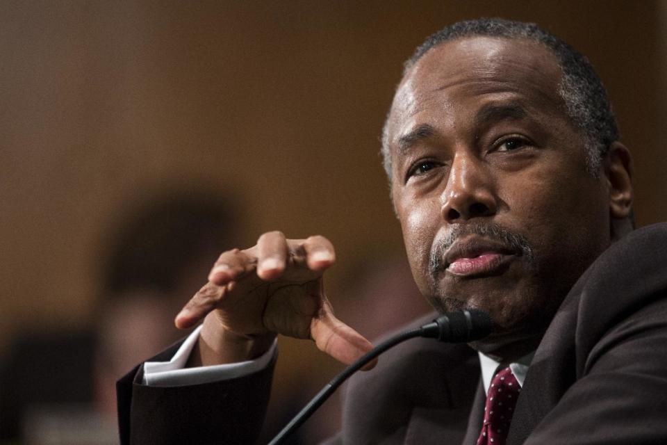 FILE - In this Jan. 12, 2017 file photo, Housing and Urban Development Secretary-designate Ben Carson testifies on Capitol Hill in Washington at his confirmation hearing before the Senate Banking, Housing, and Urban Affairs Committee. The Senate committee approved Carson for housing secretary. (AP Photo/Zach Gibson)