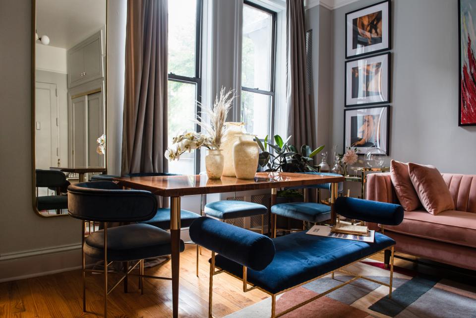 Hosting a dinner party in a 350-square-foot apartment works well with Natasha’s dining room setup. She can easily slide the bench under the table to save space when guests leave.