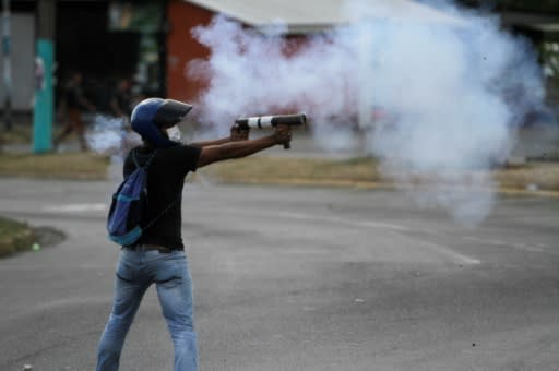 Students in the capital Managua clash with riot police during a protest against the government's social security reforms on April 20, 2018