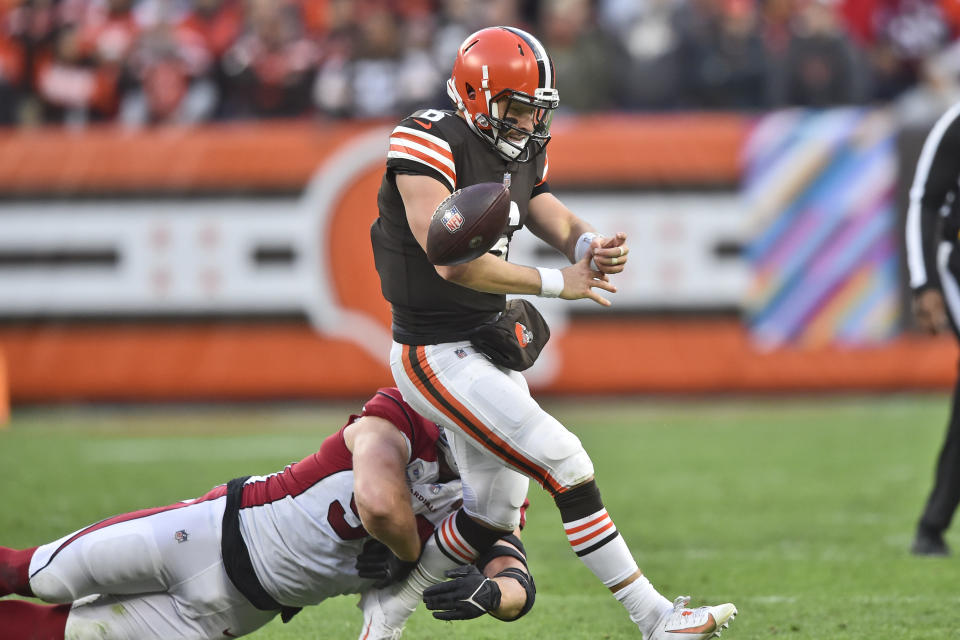 Arizona Cardinals defensive end J.J. Watt (99) tackles Cleveland Browns quarterback Baker Mayfield (6) as Mayfield fumbles during the second half of an NFL football game, Sunday, Oct. 17, 2021, in Cleveland. Mayfield was injured on the play. (AP Photo/David Richard)