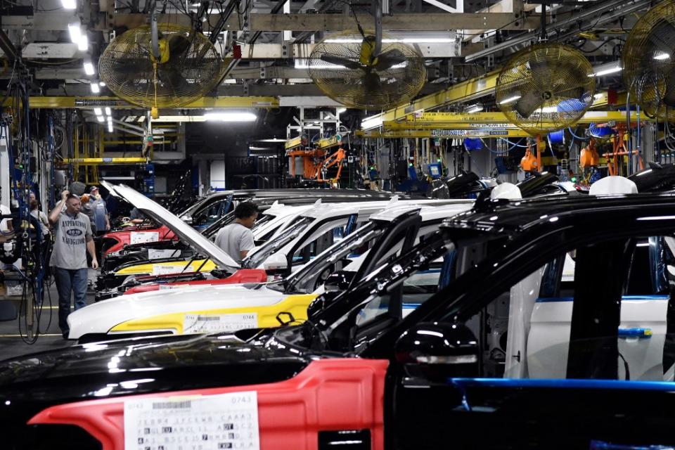 Workers assemble Ford trucks at the Ford Kentucky Truck Plant in Louisville, Kentucky. AP