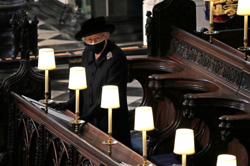 Britain's Queen Elizabeth is seen during the funeral of Britain's Prince Philip, husband of Queen Elizabeth, who died at the age of 99, at St George's Chapel, in Windsor, Britain, April 17, 2021.