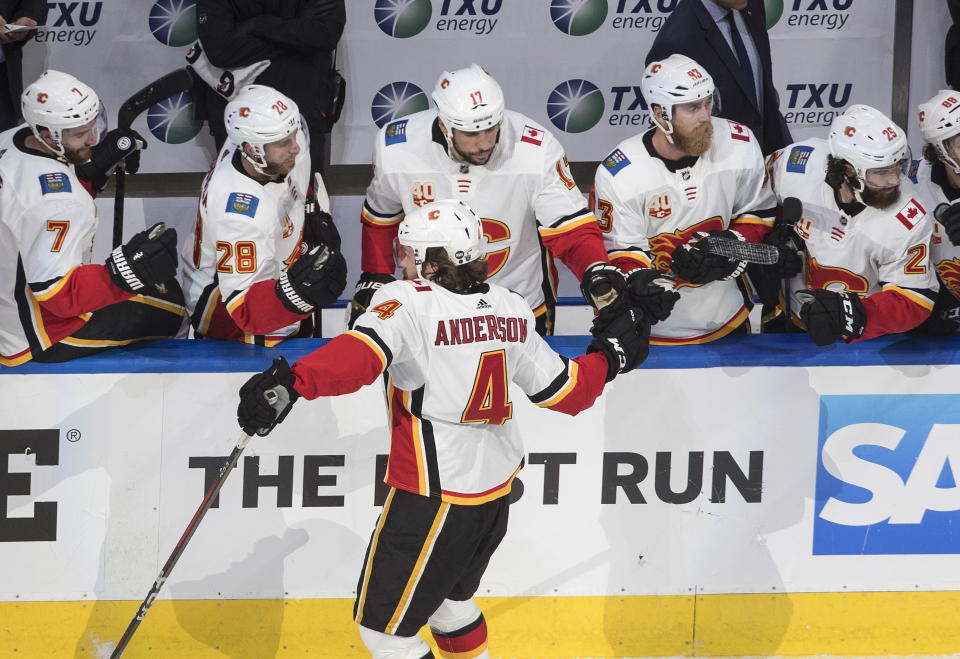 Calgary Flames' Rasmus Andersson (4) celebrates a goal against the Dallas Stars during the second period in Game 1 of an NHL hockey Stanley Cup first-round playoff series, Tuesday, Aug. 11, 2020, in Edmonton, Alberta. (Jason Franson/The Canadian Press via AP)
