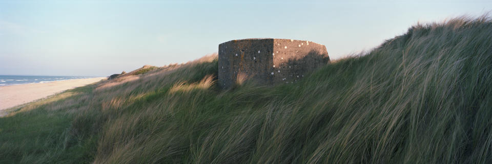 A former German defense bunker lies in Marram Grass along a stretch of coastline that was known as 'Utah Beach' during the June 6, 1944 D-Day Beach landings on April 30, 2019 in Audouville-la-Hubert, on the Normandy coast, France. (Photo: Dan Kitwood/Getty Images)