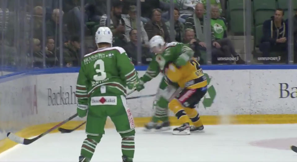 Nils Höglander of Rogle BK Angelholm (in green) elbows Fredrik Styrman of Lulea HF (in yellow) during Swedish Hockey League action on Thursday. (Twitter//@cmoresport)