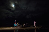 <p>A destroyed boat is seen on a beach washed up after it sunk in rough seas off the coast of Bangladesh carrying over 100 people on September 28 close to Patuwartek, Inani beach, Bangladesh. (Photograph by Paula Bronstein/Getty Images) </p>