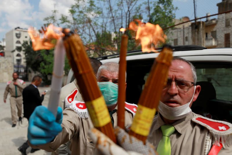 Holy Fire arrives amid coronavirus restrictions, in Ramallah in the Israeli-occupied West Bank