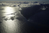 <p>The giant wings of Solar Impulse 2 are seen as it glides over the coast of Hawaii, en route to San Fransisco. (Solar Impulse/Revillard/Rezo.ch)</p>