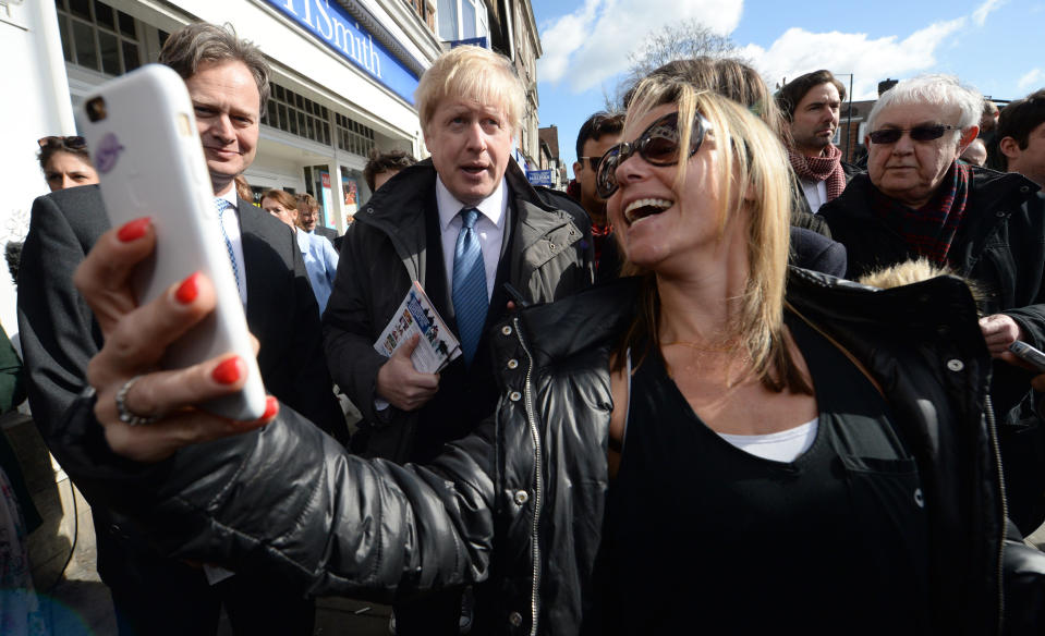 A member of the public takes a photo on their mobile phone of Mayor of London Boris Johnson after he launched the Conservative London campaign at Hartley Hall in Mill Hill, London.