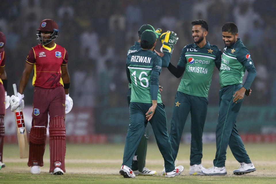Pakistan's Hasan Ali, second right, celebrates with teammates after the dismissal of West Indies' Shai Hope during the third one day international cricket match between Pakistan and West Indies at the Multan Cricket Stadium, in Multan, Pakistan, Sunday, June 12, 2022. (AP Photo/Anjum Naveed)