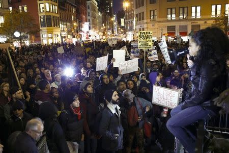 People protest against the verdict announced in the shooting death of Michael Brown, in New York, November 25, 2014. REUTERS/Eduardo Munoz