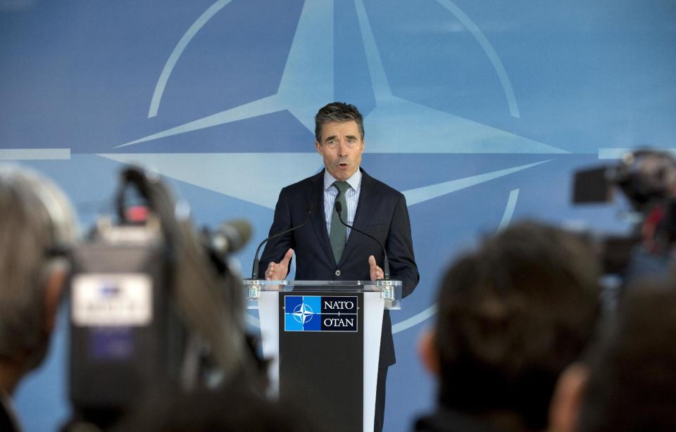 NATO Secretary General Anders Fogh Rasmussen gestures while speaking during a media conference ahead of a meeting of the North Atlantic Council at NATO headquarters in Brussels on Tuesday, April 1, 2014. NATO foreign ministers begin a two-day meeting on Tuesday in which they will discuss, among other issues, the situation in Ukraine. (AP Photo/Virginia Mayo)