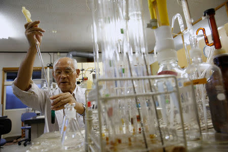 Hirokatsu Akagi, director of Minamata's International Mercury Laboratory, demonstrates his method of measuring mercury content in biological materials at his lab in Minamata, Kumamoto Prefecture, Japan, September 11, 2017. REUTERS/Kim Kyung-Hoon