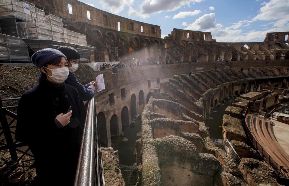 <span class="caption">In Rome, a normally packed Colosseum is virtually empty. </span> <span class="attribution"><span class="source">AP Photo/Andrew Medichini</span></span>