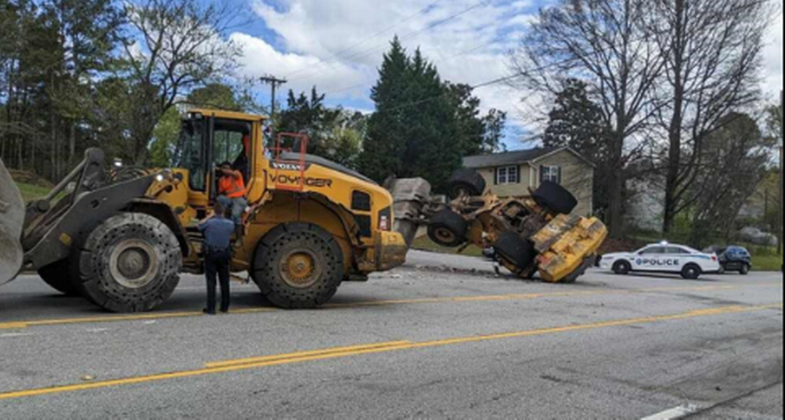 The chase was in its fifth mile when the pursuing front end loader managed to get its bucket in a good position and flip the stolen vehicle, video shows.