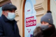 People are seen outside a vaccination centre in the State Department Store, GUM, in Moscow