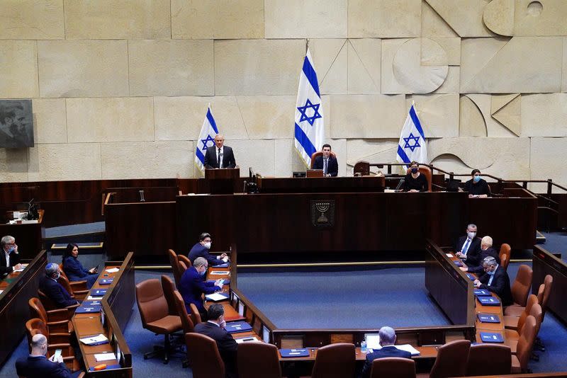 Benny Gantz, centrist Blue and White leader, and Israeli Prime Minister Benjamin Netanyahu's partner in his new unity government, speaks during a swearing in ceremony of the new government, at the Knesset, Israel's parliament, in Jerusalem