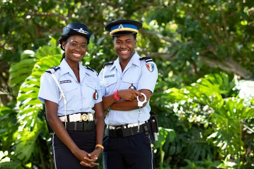 Naomi Thomas (Shantol Jackson) and Marlon Pryce (Tahj Miles) on Death in Paradise