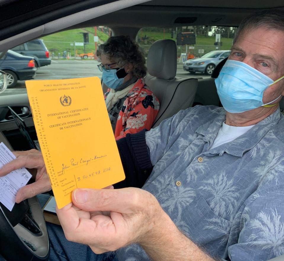 John Paul Cruger-Hansen, 77, brought the International Certificate of Vaccination he presented when he came to the USA decades ago from Denmark that proved he'd been vaccinated for smallpox. He hoped to get his COVID-19 vaccination noted in it at a mass vaccination clinic in San Francisco on Jan. 22.