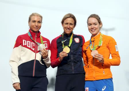 2016 Rio Olympics - Cycling Road - Victory ceremony - Women's Individual Time Trial Victory ceremony - Pontal - Rio de Janeiro, Brazil - 10/08/2016. Olga Zabelinskaya (RUS) of Russia, Kristin Armstrong (USA) of USA and Anna van der Breggen (NED) of Netherlands pose with their medals. REUTERS/Matthew Childs