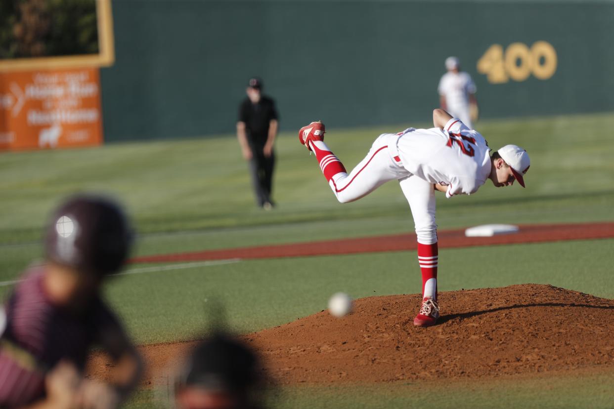 Albany’s Cole Chapman (12) pitches in the second inning.