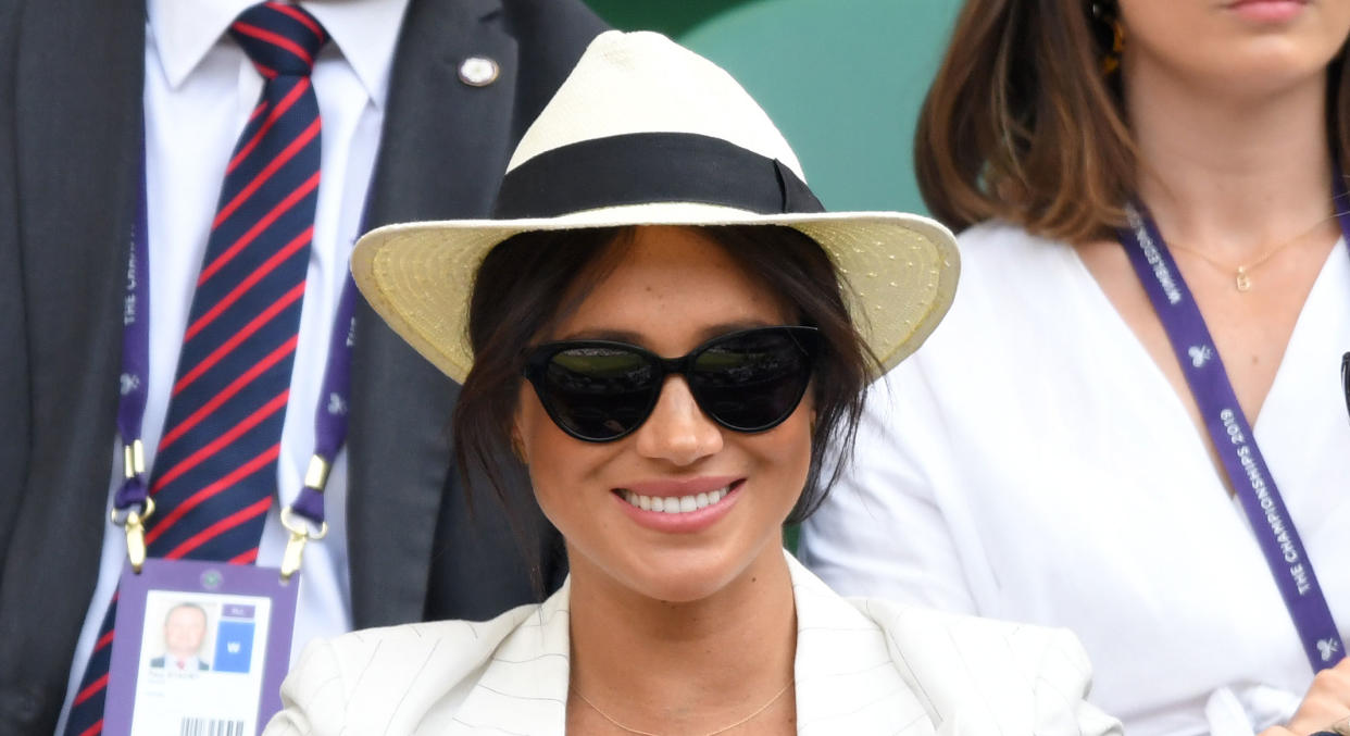The Duchess of Sussex is never seen without her favourite Biltmore x Madewell straw hat [Photo via Getty Images]