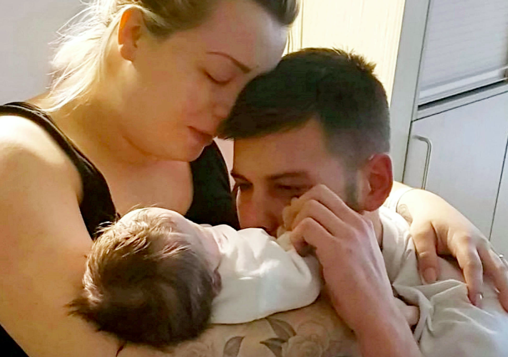 Brogan Smith and Jamie Scrimshaw released heartbreaking photos that showed them tenderly holding their daughter Lilah. (SWNS)