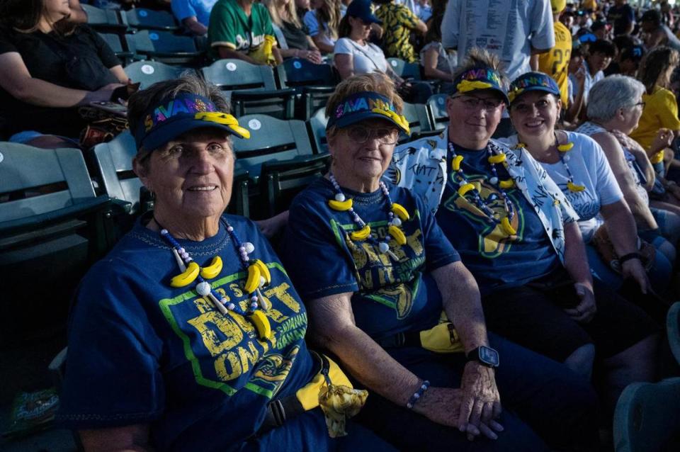 Cookie Cox, left, of Biggs, Candy Brandt, left center, of Oroville; Chris Cox, right center, of Gridley; and DeDe Fairbanks, of Oroville; came to the game with gear they made before the Savannah Bananas World Tour on Saturday, July 29, 2023, at Sutter Health Park in West Sacramento. “It’s a lot better than the insanity you imagine,” Cox said of experiencing the Bananas in person.