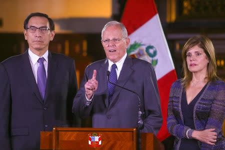 FILE PHOTO: Peruvian President Pedro Pablo Kuczynski (C) accompanied by his vice-presidents Martin Vizcarra (L) and Mercedes Araoz addresses the nation at the Government Palace in Lima, Peru, December 20, 2017. Peruvian Government Palace/Handout via Reuters.