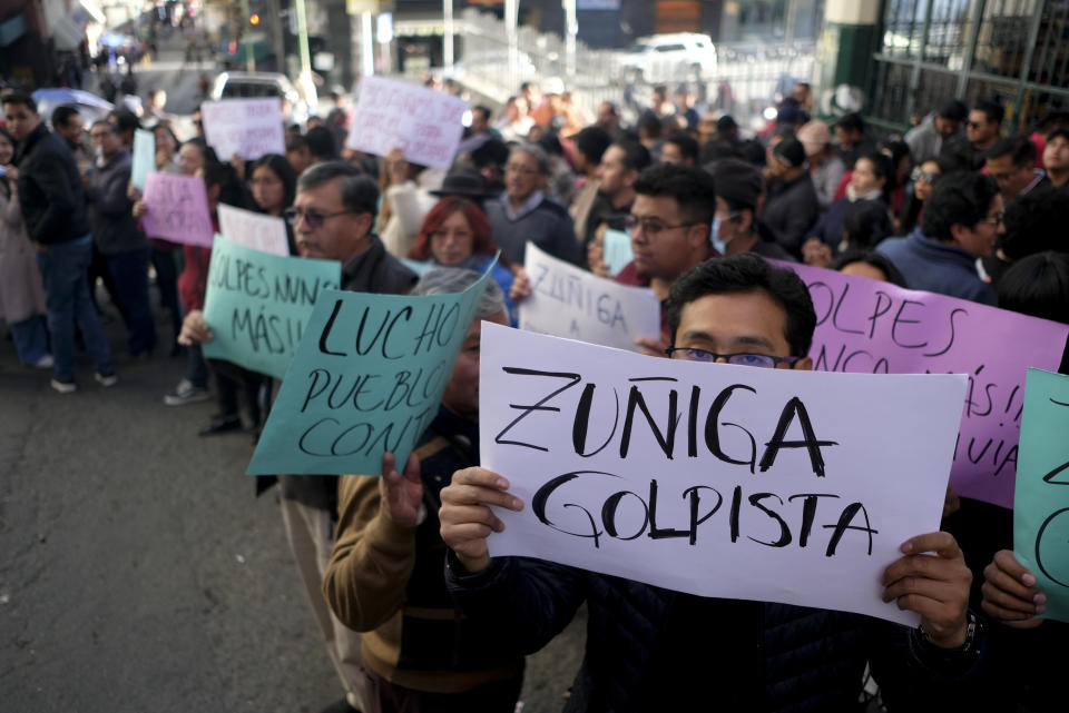 Supporters of President Luis Arce demonstrate outside the prosecutor's office demanding jail time for Juan Jose Zuniga, former commanding general of the army, in La Paz, Bolivia, Friday, June 28, 2024, two days after Army troops stormed the government palace in what President Luis Arce called a coup attempt. (AP Photo/Carlos Sanchez)