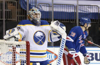 Buffalo Sabres' Carter Hutton (40)s pauses following a second-period goal by New York Rangers' Chris Kreider, right, during an NHL hockey game Tuesday, March 2, 2021, in New York. (Bruce Bennett/Pool Photo via AP)