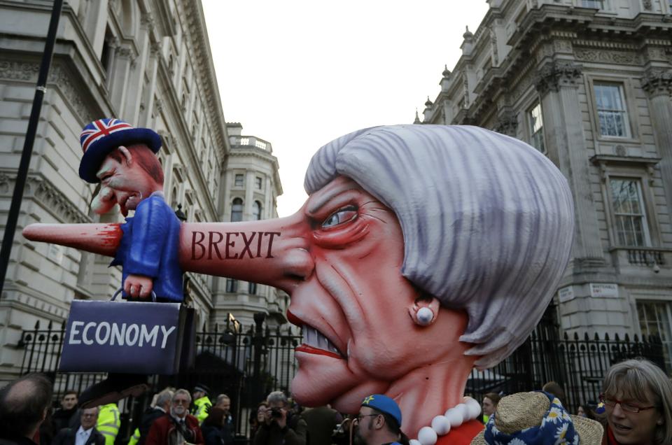 An effigy of British Prime Minister Theresa May passes by Downing Street during a Peoples Vote anti-Brexit march in London, Saturday, March 23, 2019. Anti-Brexit protesters swarmed the streets of central London by the tens of thousands on Saturday, demanding that Britain's Conservative-led government hold a new referendum on whether Britain should leave the European Union. (AP Photo/Kirsty Wigglesworth)