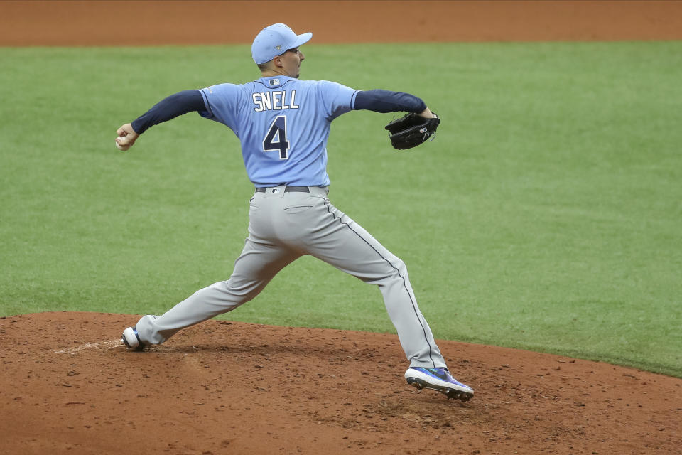 FILE - In this Wednesday, July 8, 2020, file photo, Tampa Bay Rays' Blake Snell throws during baseball practice in St. Petersburg, Fla. (AP Photo/Mike Carlson, File)