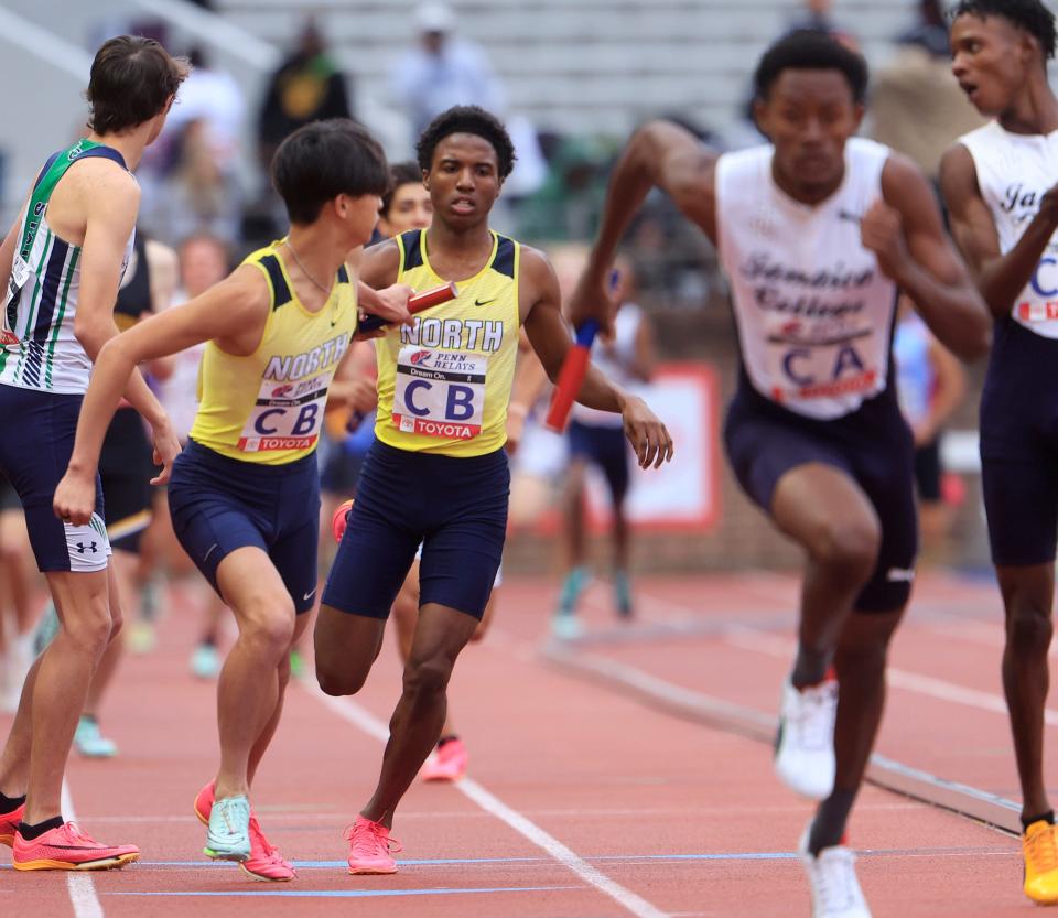 Toms River North's Taysaun Wilson hands off to William Brommeland during High School boys 4X800. Day one of Penn Relays in Philadelphia, Pa. On April 27, 2023.