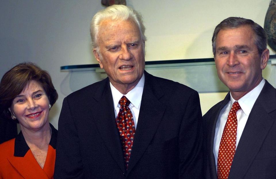 JACKSONVILLE, UNITED STATES:  Republican Presidential candidate Texas Governor George W. Bush and his wife Laura stand beside the Rev. Billy Graham (C) as Graham announces his support for Bush 05 November, 2000 in a hotel suite  in Jacksonville, Florida. The US general election, which is neck-and-neck in the race for US president according to polling data, is 07 November 2000.   AFP PHOTO/Paul J. RICHARDS (Photo credit should read PAUL J. RICHARDS/AFP/Getty Images)